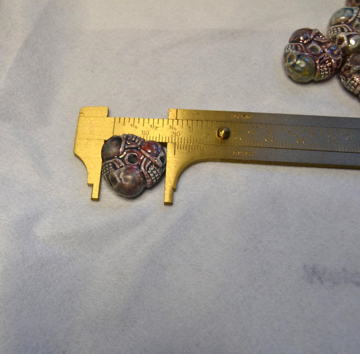 Tri-Skull Peruvian porcelain beads, raku or Bisque finish