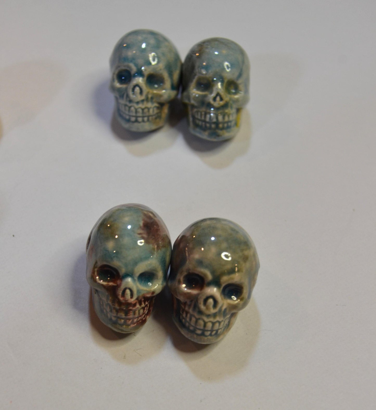Peruvian Skull bead, glazed sold in pairs
