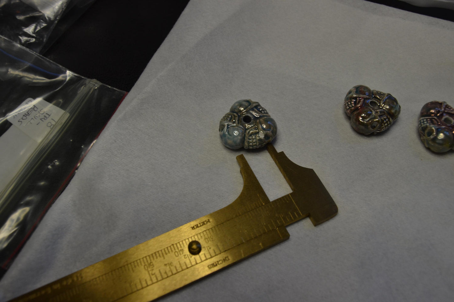 Tri-Skull Peruvian porcelain beads, raku or Bisque finish