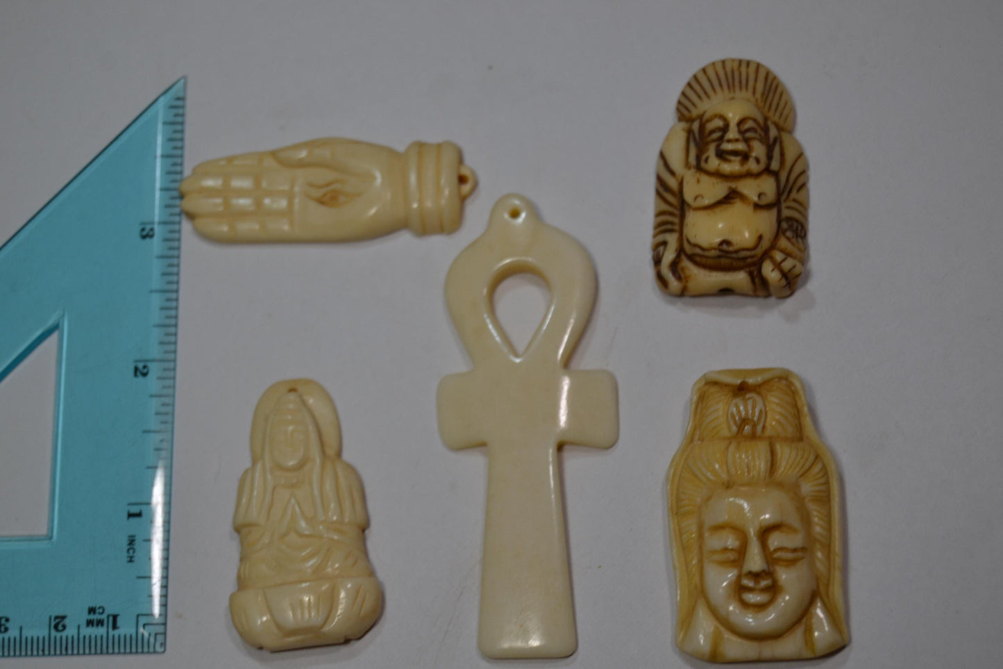 Hand carved bone, spiritual pendants