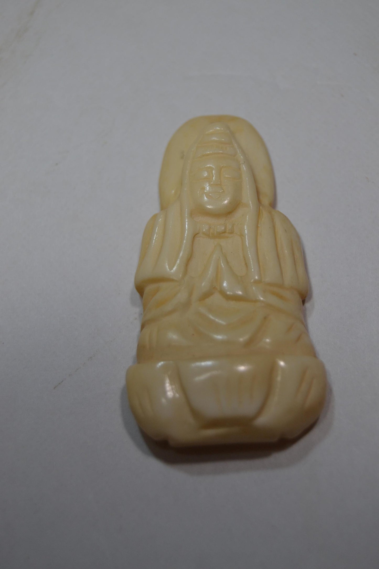 Hand carved bone, spiritual pendants