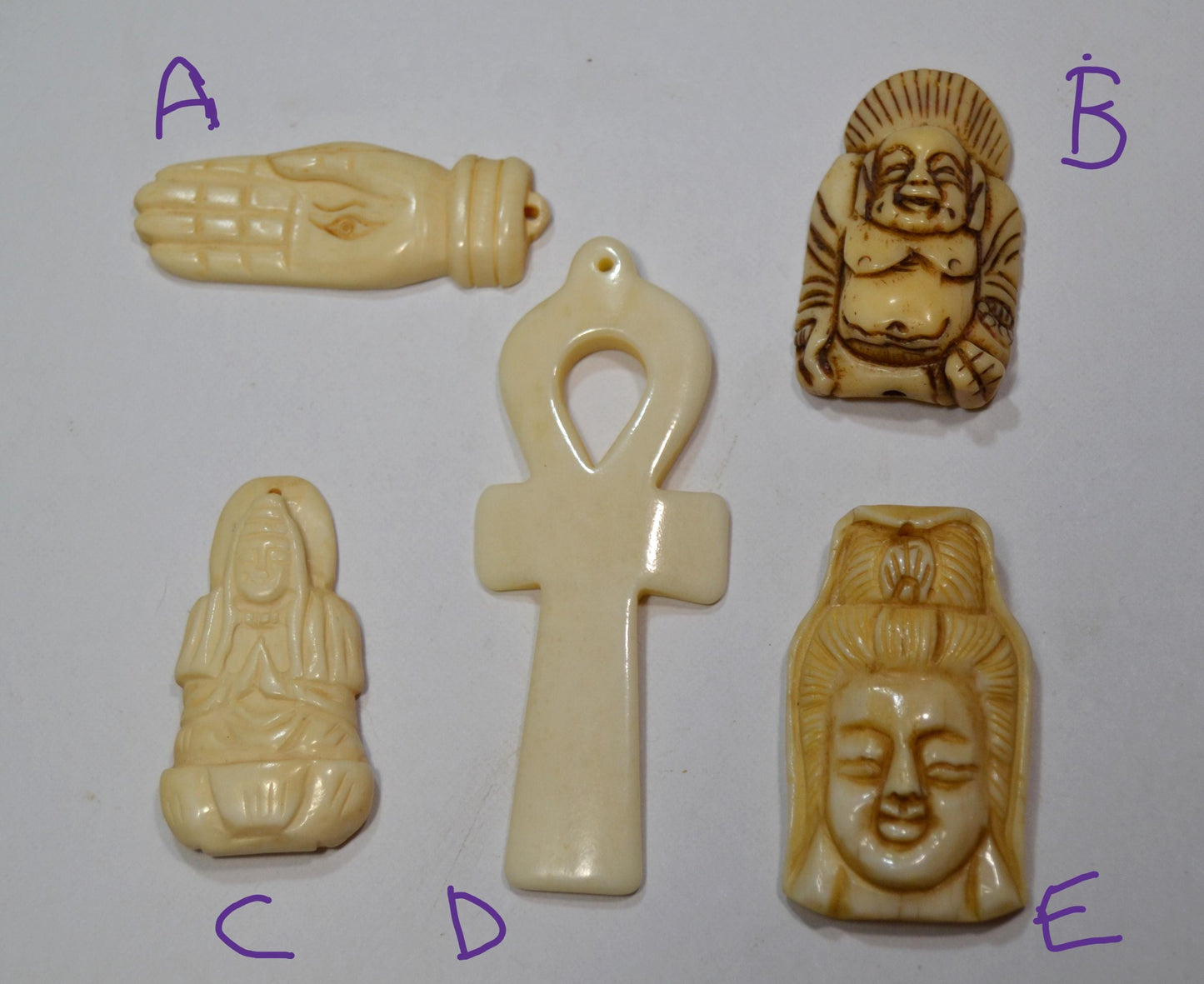 Hand carved bone, spiritual pendants