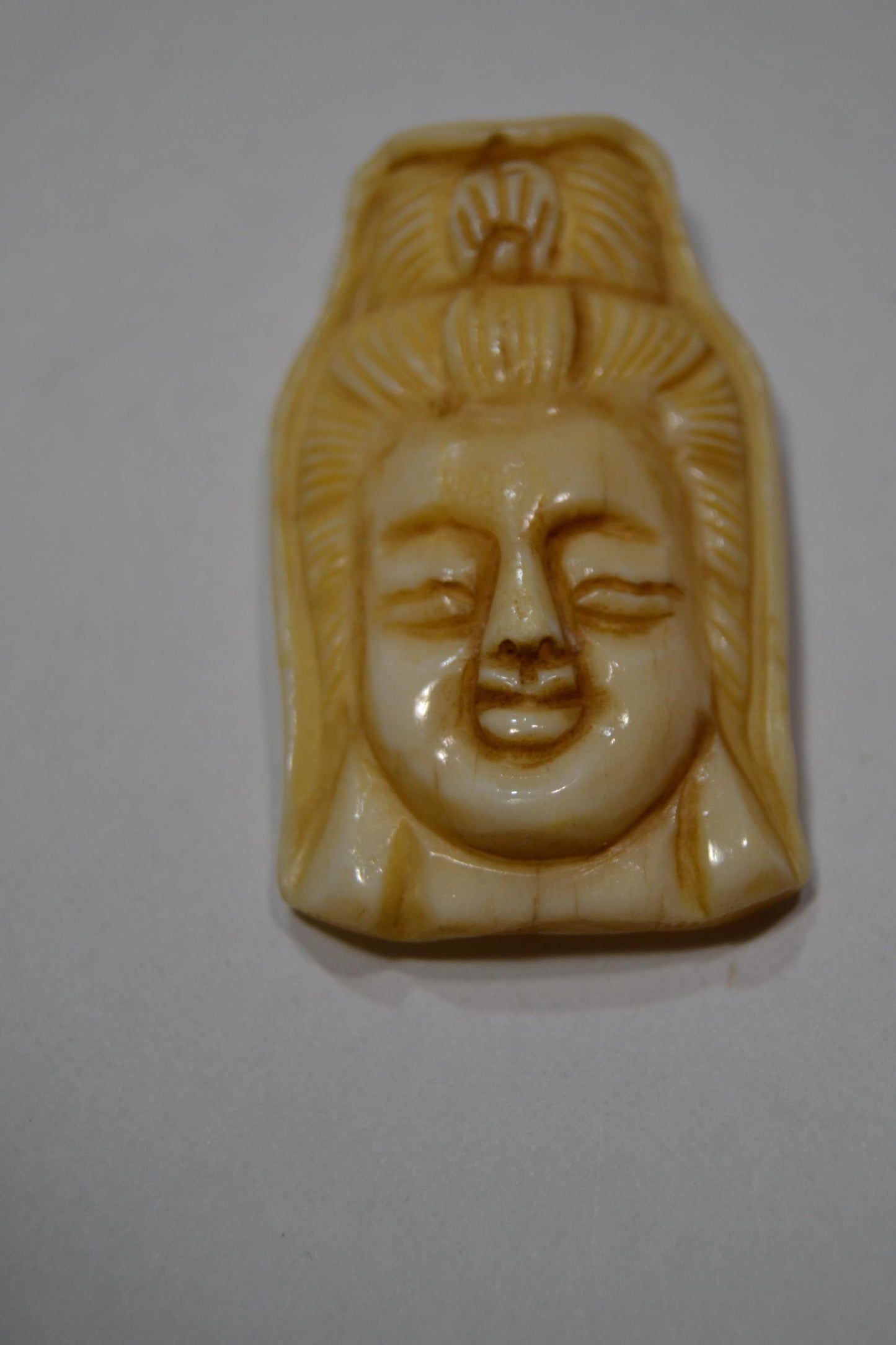 Hand carved bone, spiritual pendants