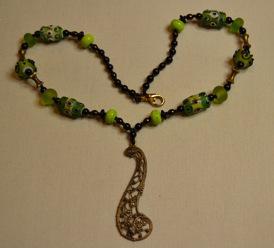 Metal and green lamp work glass beads, vintage feel