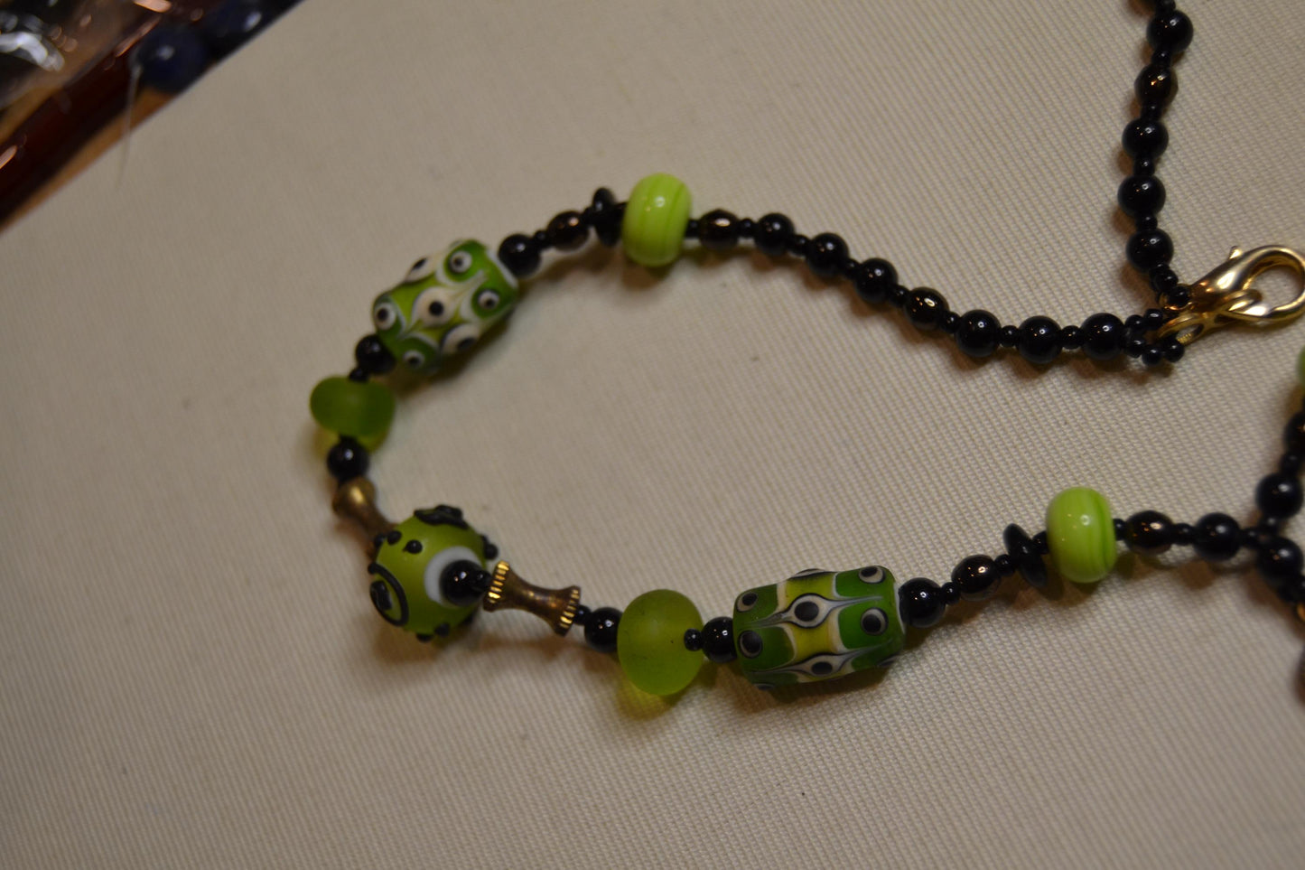 Metal and green lamp work glass beads, vintage feel