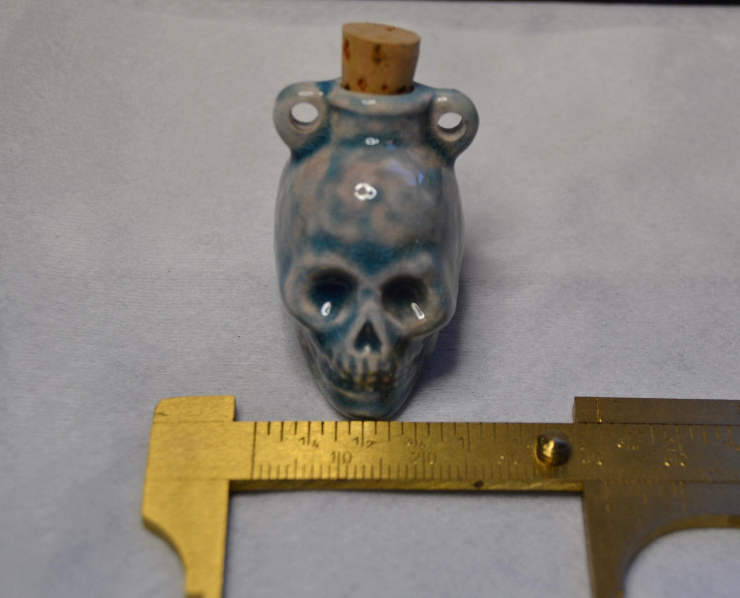 Skull potion bottle/vessel pendant