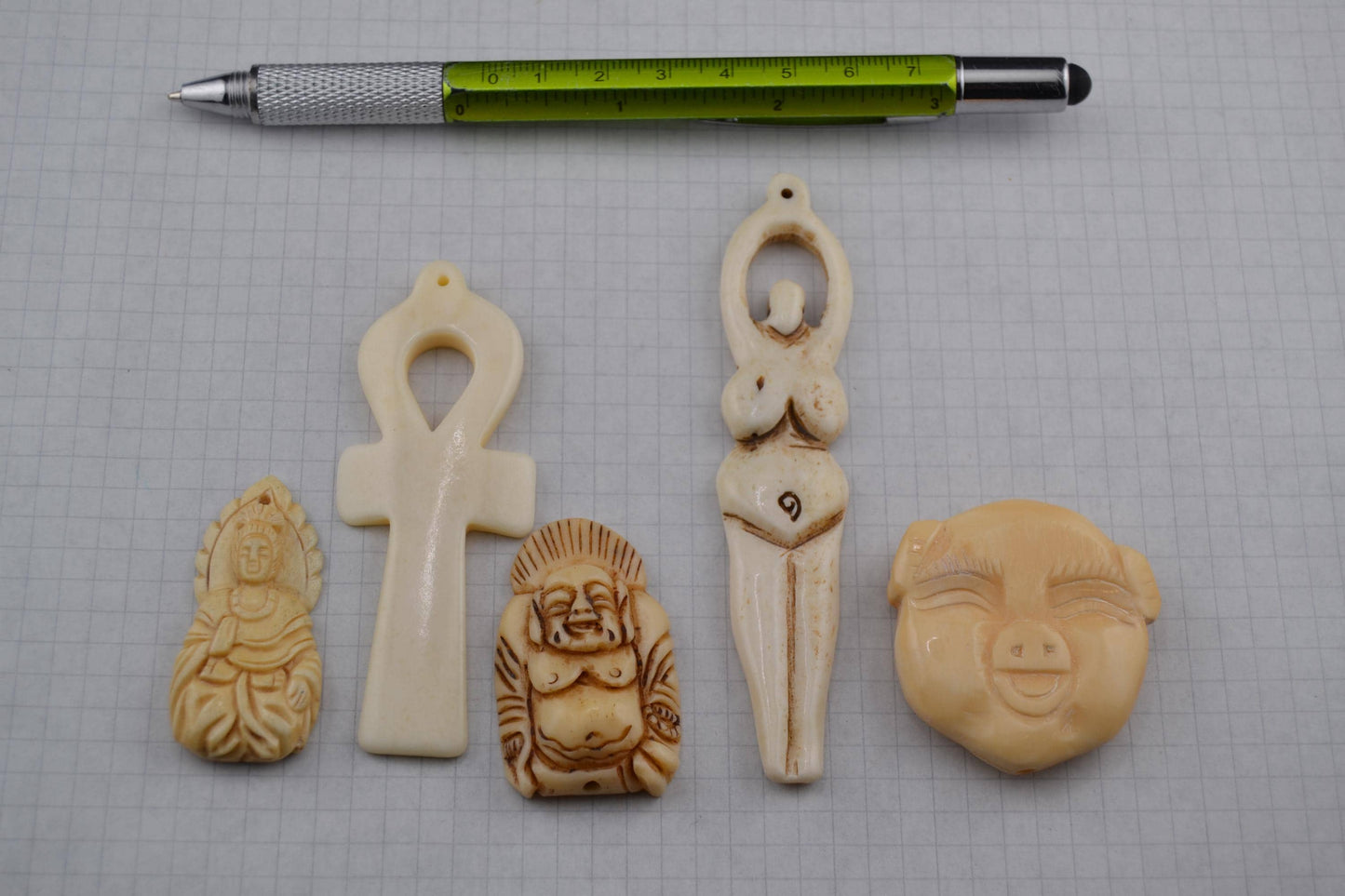 Bone goddess, deity and luck carved bone pendants
