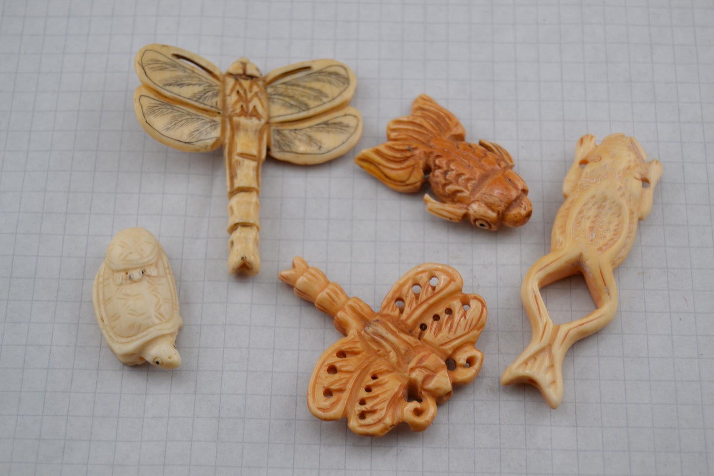 Hand-carved animal beads from bone